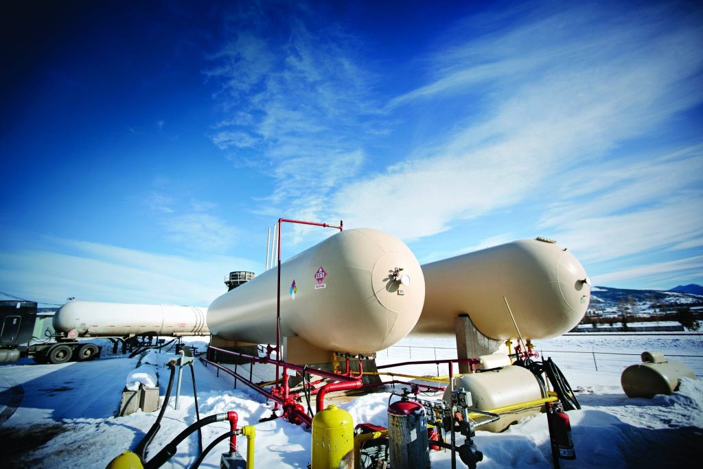 large outdoor propane tanks in snowy field